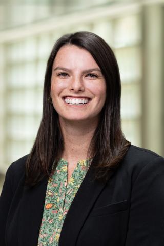 Photo of a woman with brown hair who is smiling